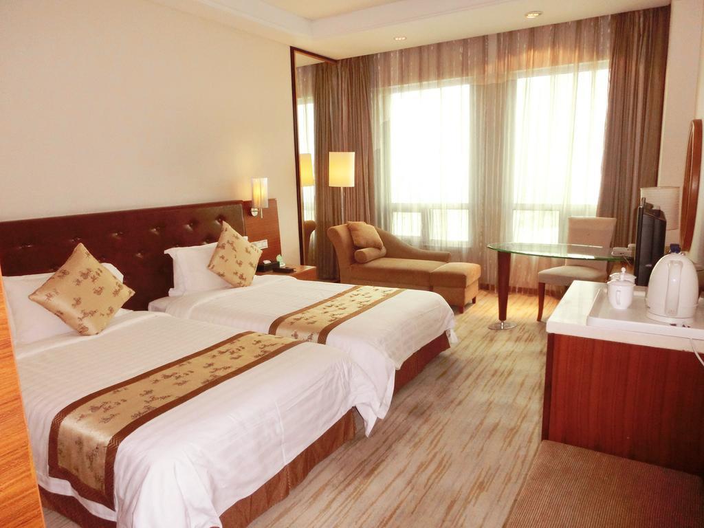 Hotel Ramada Plaza Cantón Habitación foto