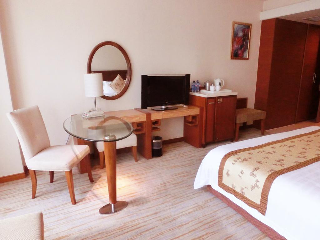 Hotel Ramada Plaza Cantón Habitación foto