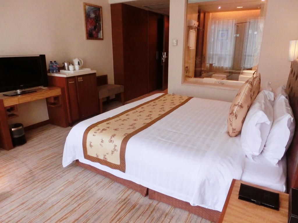 Hotel Ramada Plaza Cantón Habitación foto