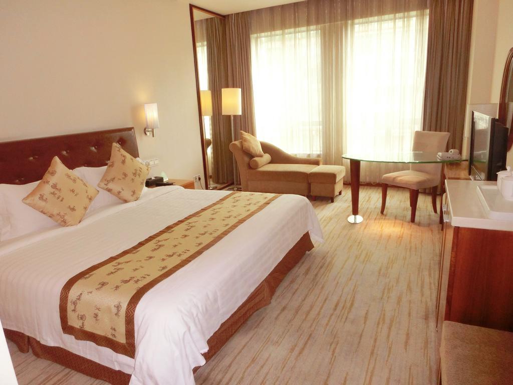 Hotel Ramada Plaza Cantón Habitación foto